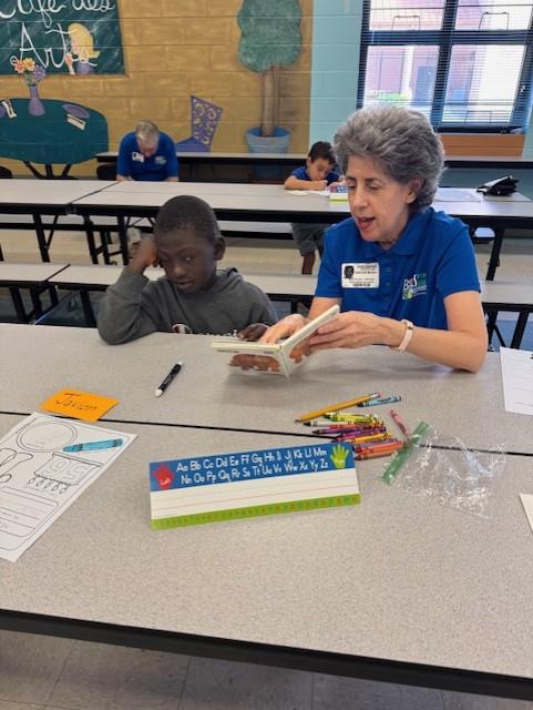 student with a reader